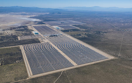 The solar field of Mojave Solar covers nearly 2 square miles with 2,200 mirrored parabolic trough collectors and 1.5 million square meters of reflective area.
